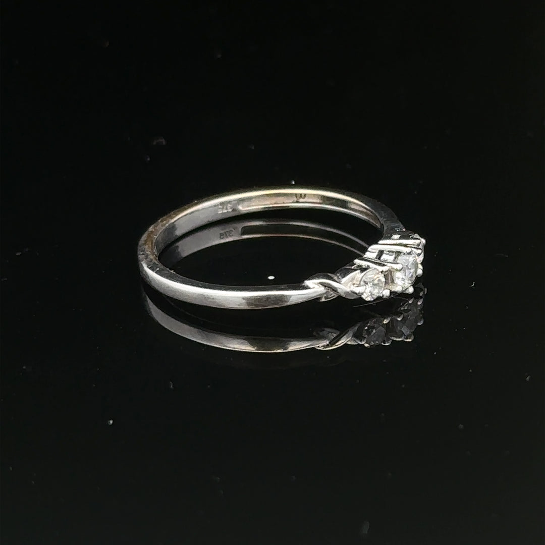 9ct white gold diamond ring in size Q1/2 with sparkling diamonds, elegant jewelry piece with a polished finish.