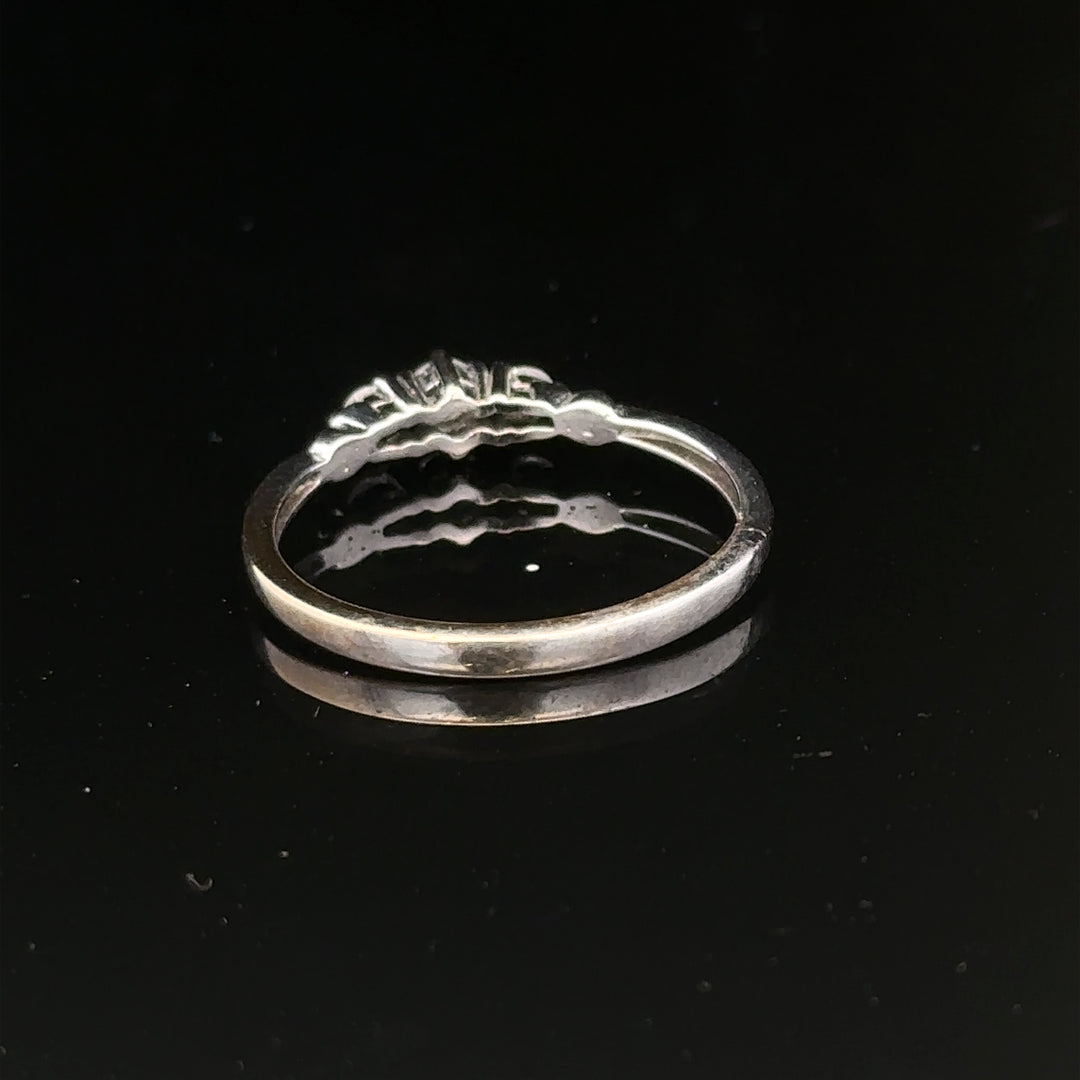 9ct white gold diamond ring in size Q1/2 with sparkling diamonds, showcasing elegant jewelry craftsmanship.