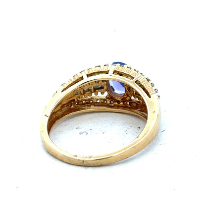 18ct yellow gold diamond and tanzanite ring in size N1/2, featuring a detailed close-up of the elegant jewelry design.