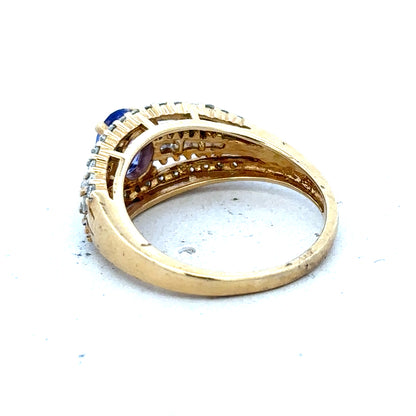 18ct yellow gold diamond and tanzanite ring in size N1/2 with sparkling gemstones and elegant design.