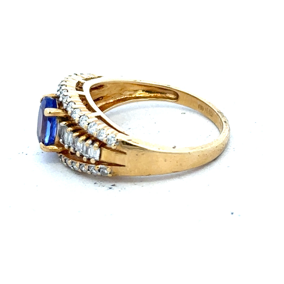 18ct yellow gold diamond and tanzanite ring, size N1/2, featuring a sparkling gemstone design and elegant craftsmanship.