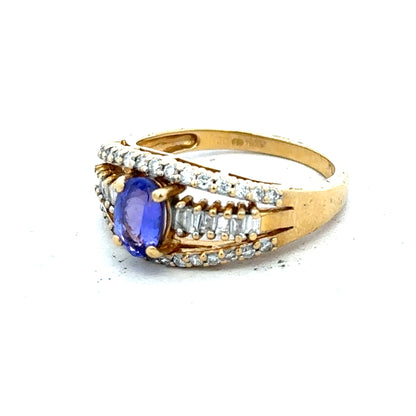 18ct yellow gold diamond and tanzanite ring in size N1/2, featuring a sparkling gemstone design.