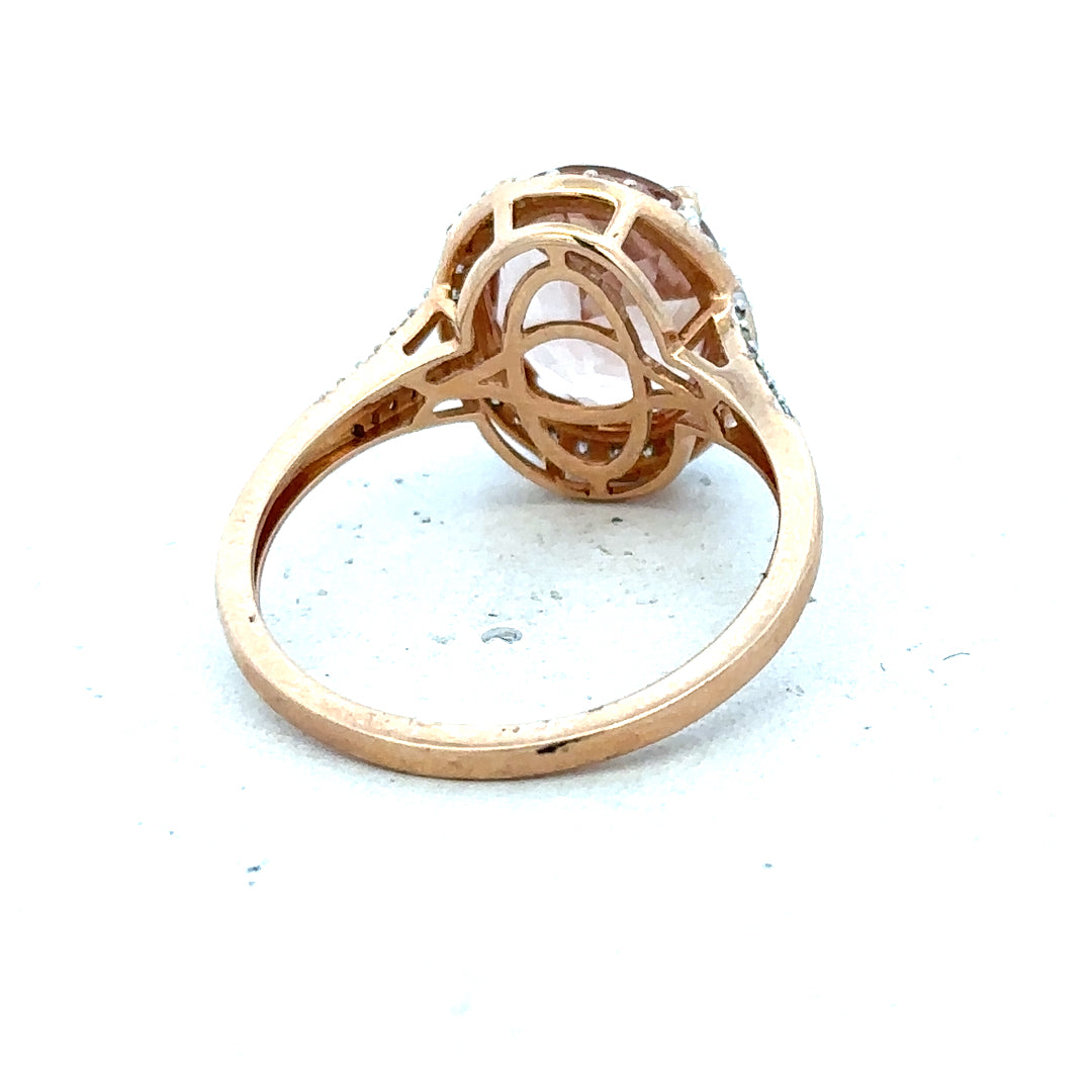 14ct gold Morganite and diamond ring in size S, featuring a sparkling center stone and elegant band design.