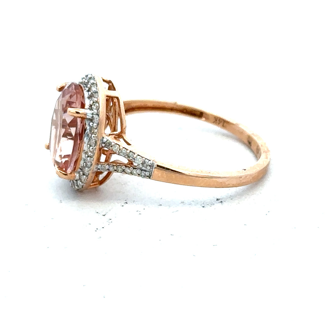 14ct gold Morganite and diamond ring in size S, showcasing sparkling gemstones and elegant design on a jewelry ring.