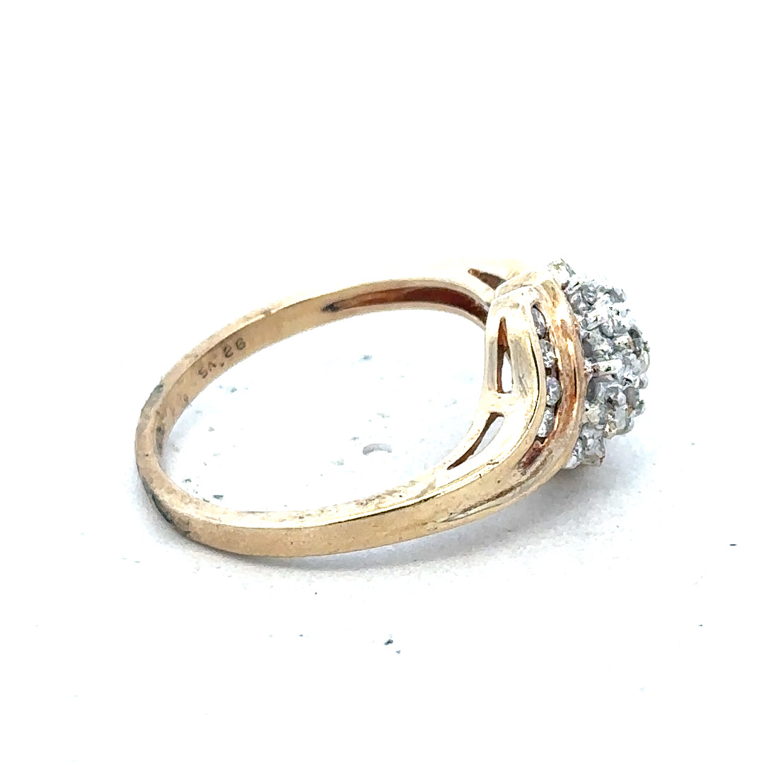 9ct yellow gold diamond ring with 0.26 carat center stone, size P, featuring a delicate band and sparkling diamonds.