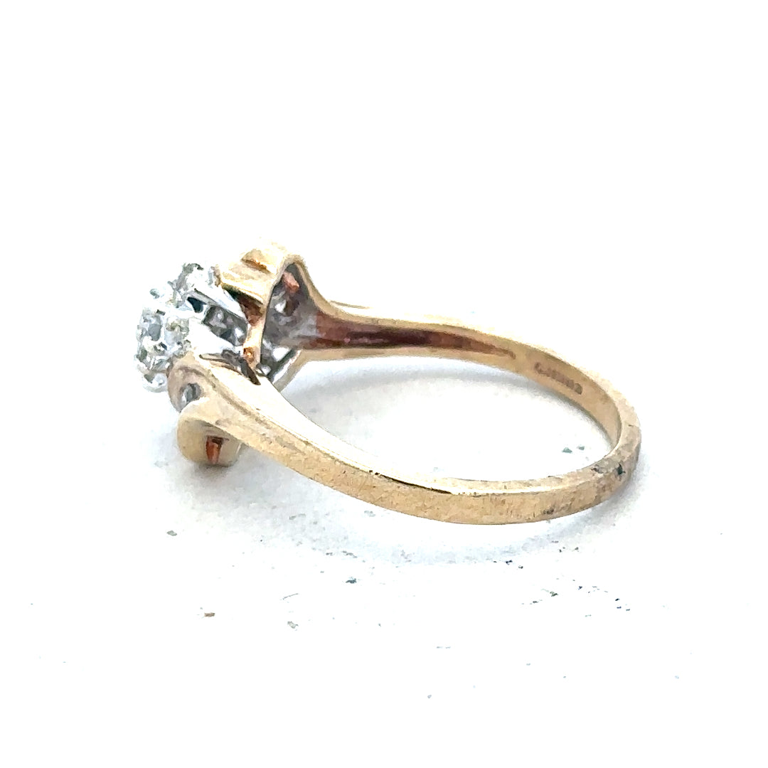 9ct yellow gold diamond ring with 0.26 carats, size P, featuring a delicate band and sparkling diamonds.