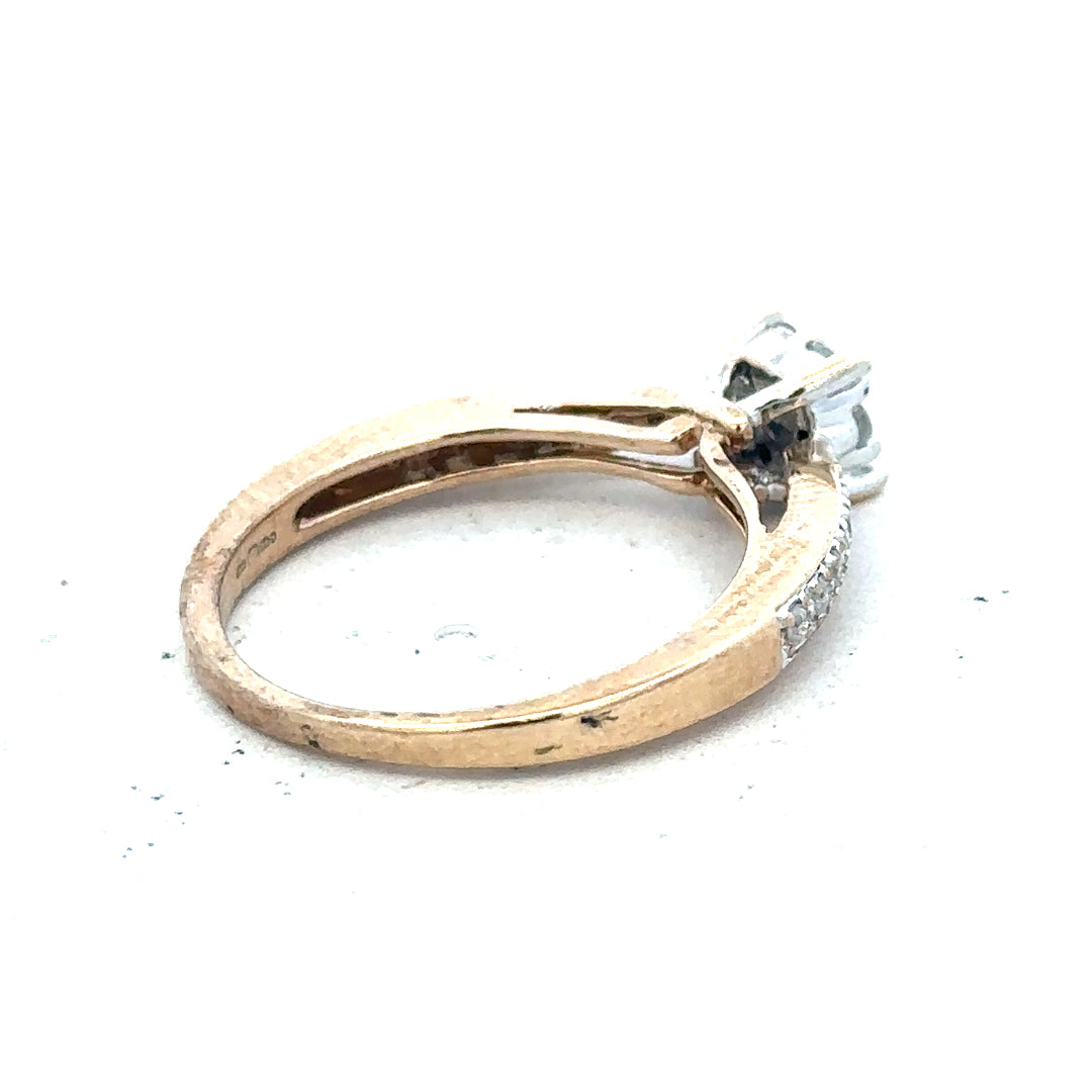 9ct yellow gold diamond ring in size P, featuring a sparkling diamond set in a polished gold band.