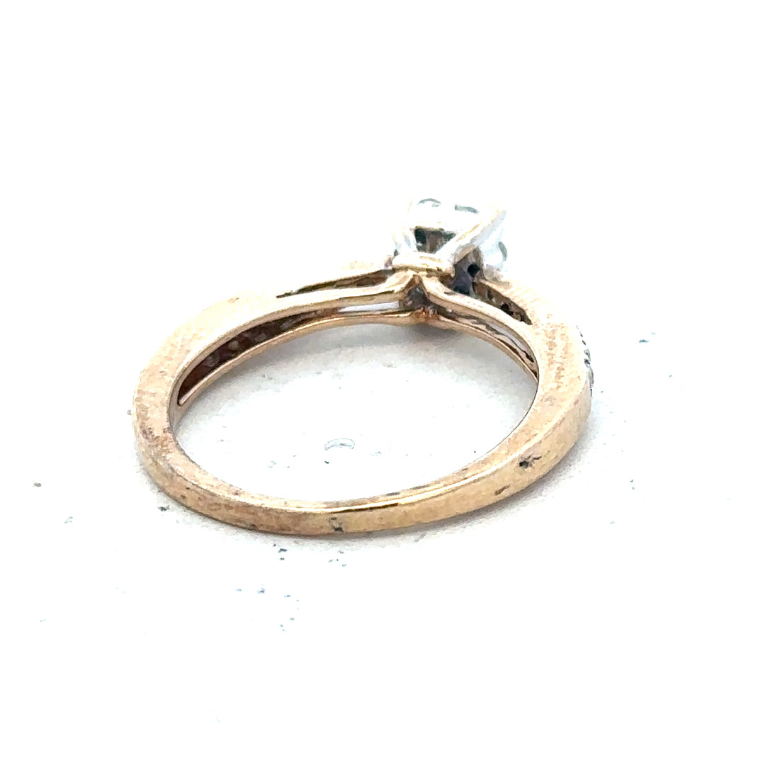 9ct yellow gold diamond ring in size P with sparkling diamonds, showcasing elegant jewelry design.