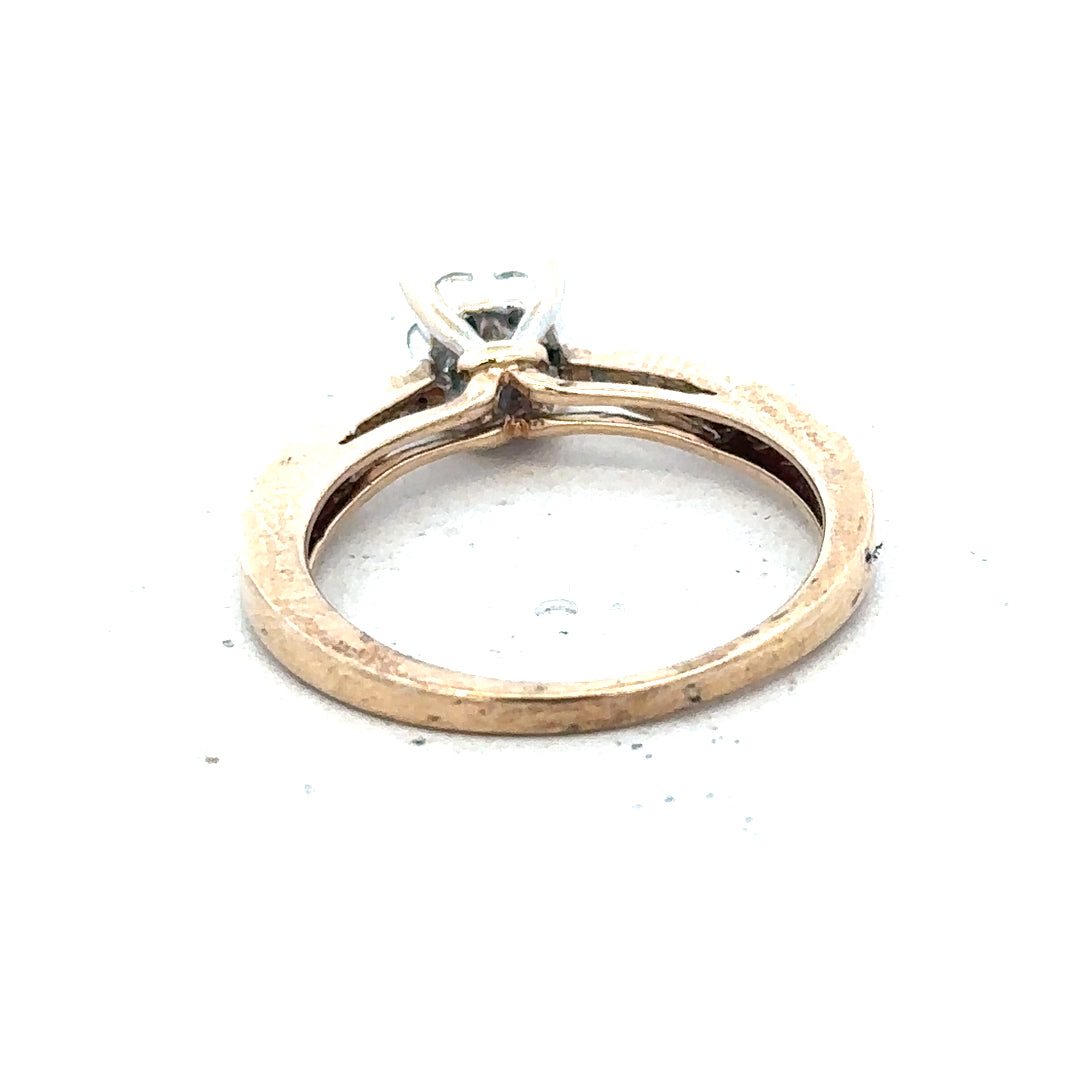 Yellow gold diamond ring in size P with sparkling gemstones, unbranded 9ct gold jewelry, close-up view of the ring.