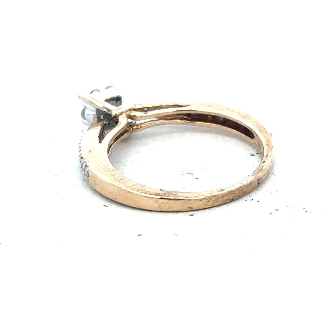 9ct yellow gold diamond ring size P with sparkling gemstones, showcasing elegant craftsmanship and a polished finish.