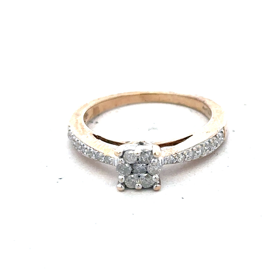 9ct yellow gold diamond ring in size P with sparkling stones, showcasing a classic and elegant jewelry design.