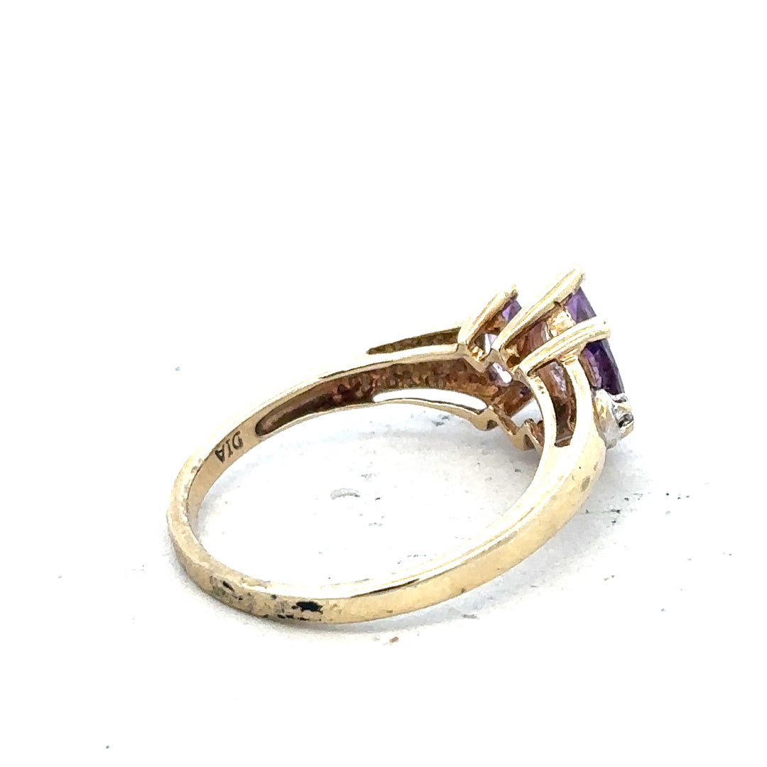 9ct yellow gold amethyst and diamond ring, size P, featuring a central purple gemstone and sparkling accent diamonds.