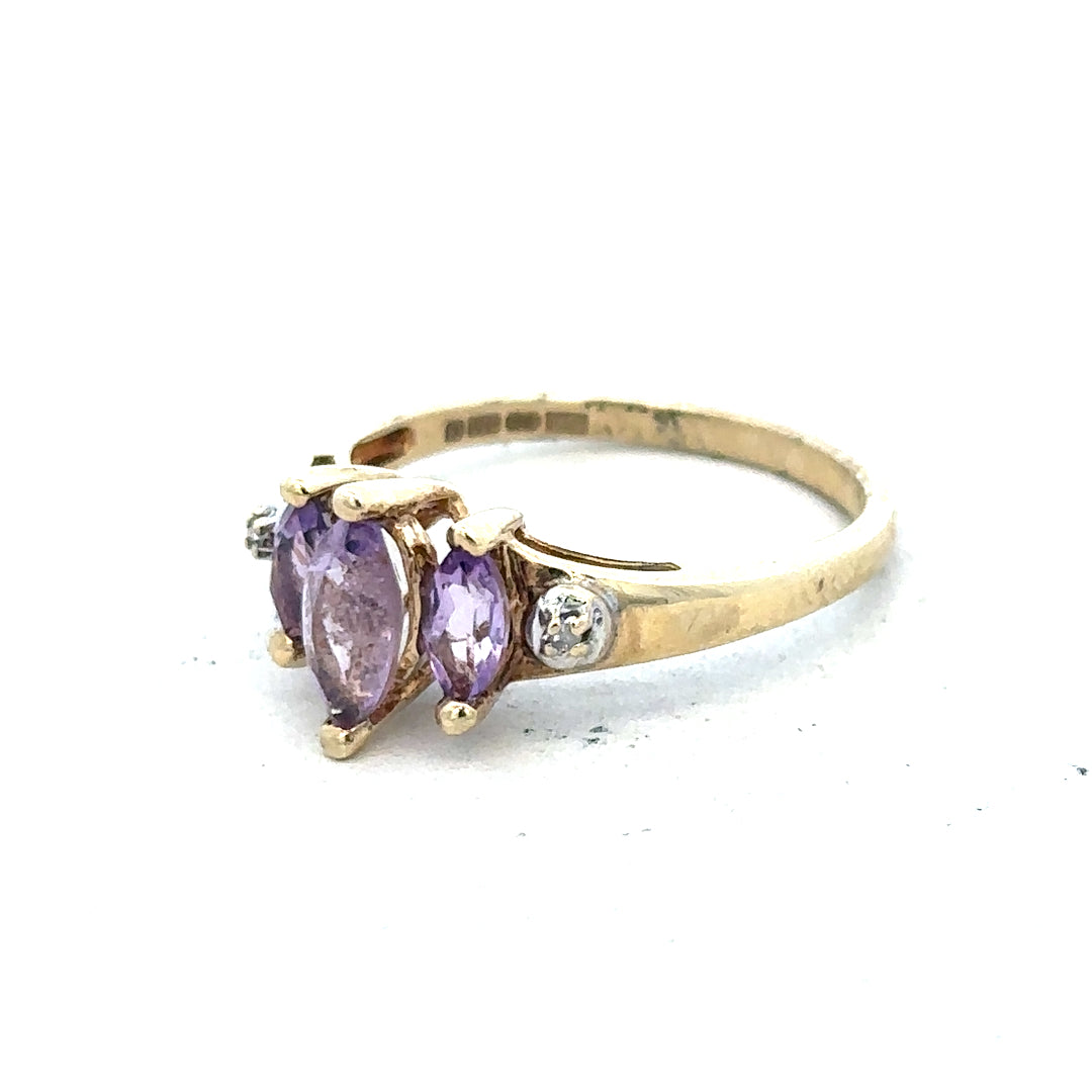 9ct yellow gold amethyst and diamond ring in size P, featuring a central purple gemstone with sparkling side diamonds.