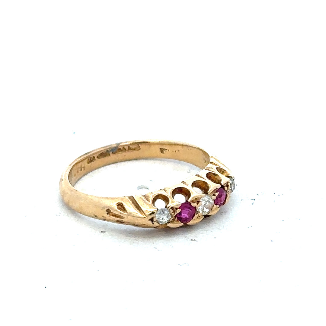 18ct yellow gold diamond and ruby ring in size N with intricate design and sparkling gemstones.
