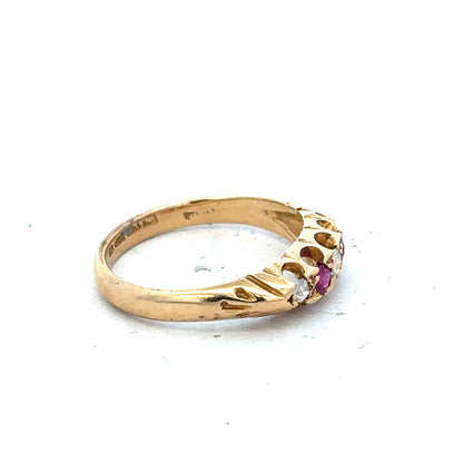 Yellow gold diamond and ruby ring, size N, featuring sparkling gemstones and intricate band design.