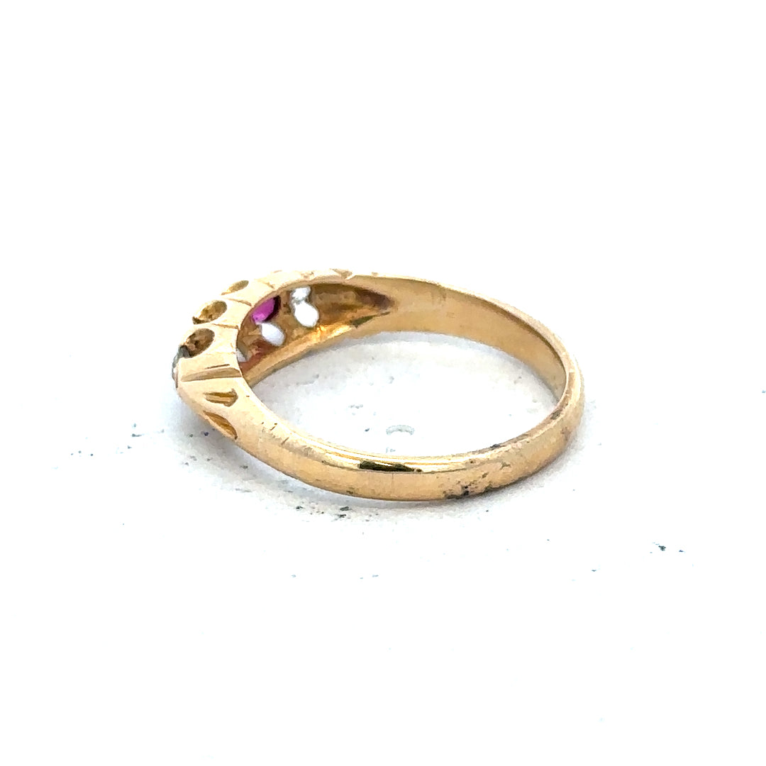 18ct yellow gold diamond and ruby ring, size N, featuring a polished band with sparkling gemstones and intricate design.