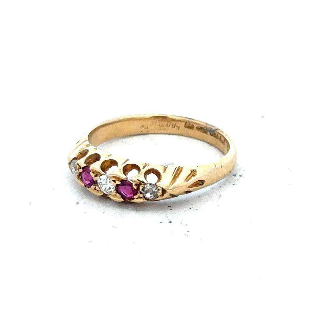 18ct yellow gold diamond and ruby ring, size N, featuring intricate gemstone accents and a polished gold band.