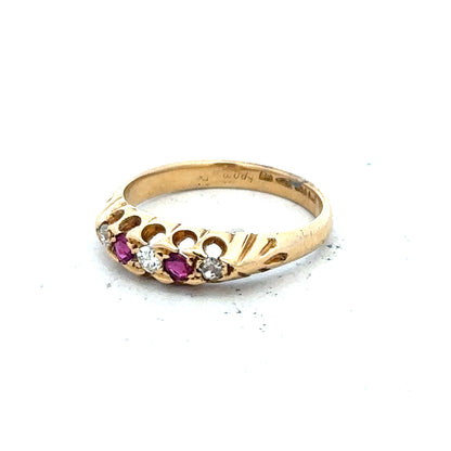 18ct yellow gold diamond and ruby ring, size N, featuring intricate gemstone accents and a polished gold band.