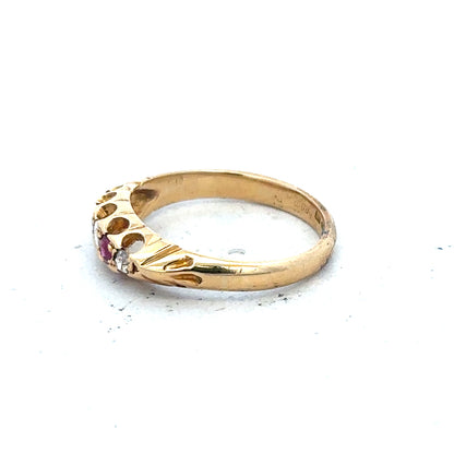 18ct yellow gold ring with diamonds and rubies, size N, featuring intricate design and sparkling gemstones.