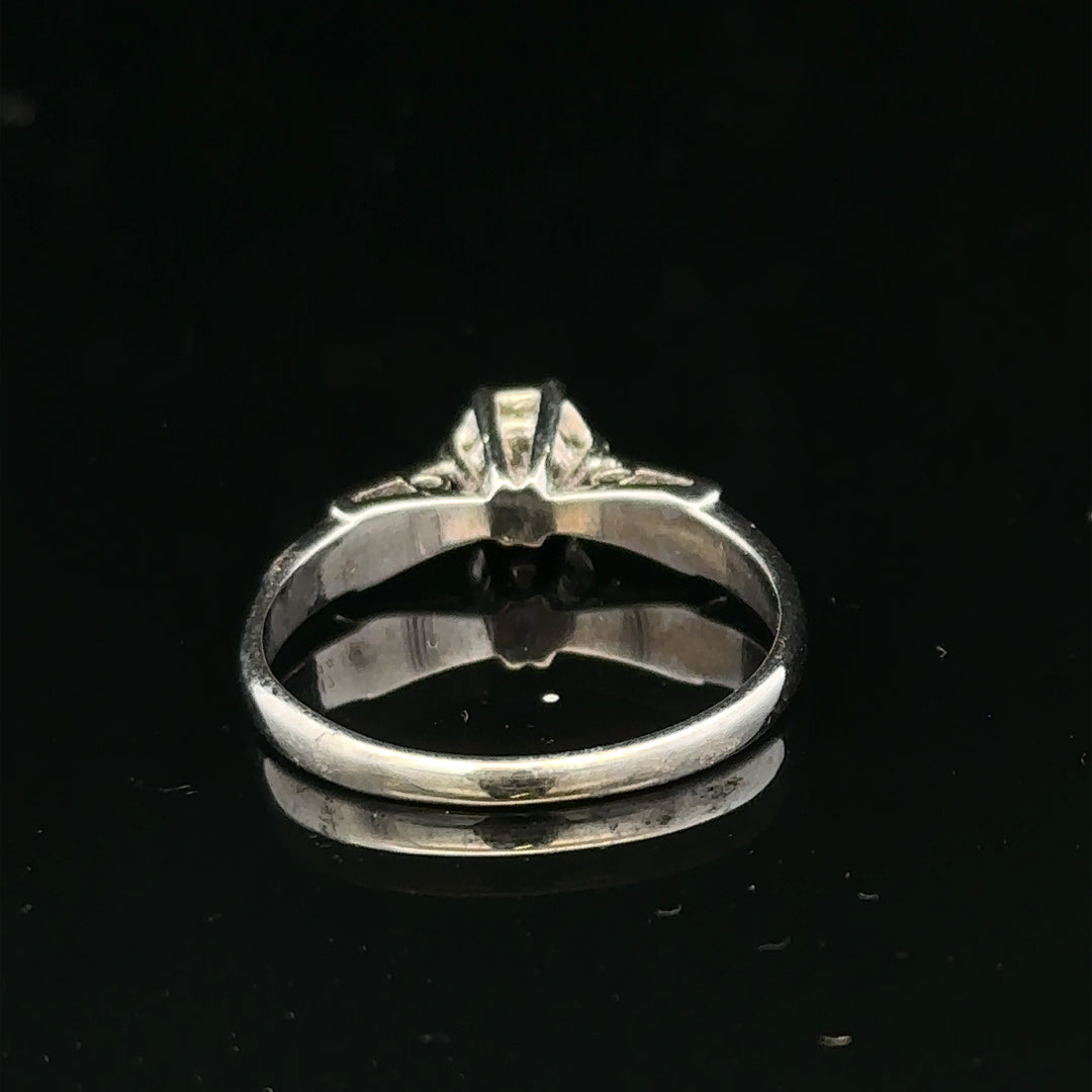 9ct white gold diamond ring with sparkling diamonds, showcasing elegant design and craftsmanship.