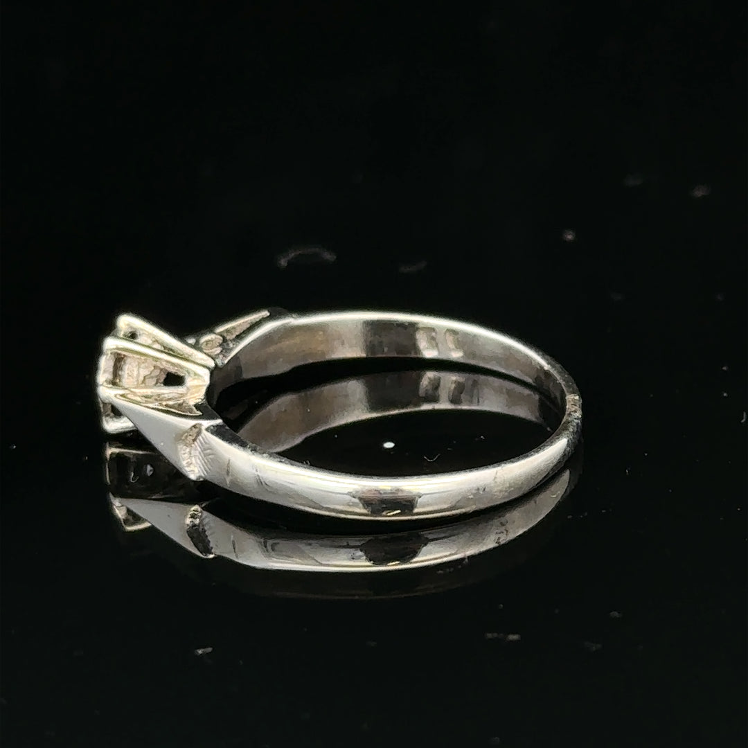 9ct white gold diamond ring featuring sparkling diamonds, elegant design, unbranded jewelry, shown in close-up on a white background.