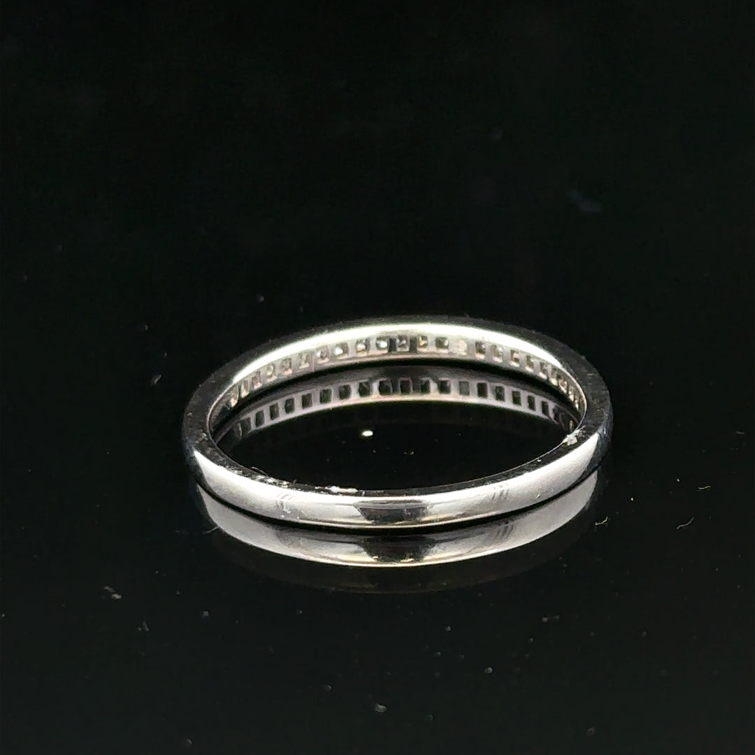 18ct white gold diamond ring with small sparkling diamonds, size Q1/2, featuring a sleek and elegant design.