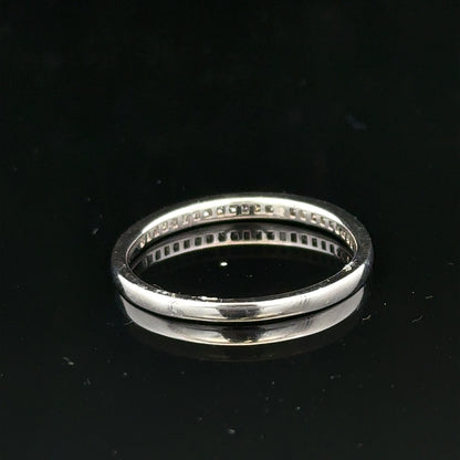 18ct white gold diamond ring with small sparkling diamonds, size Q1/2, featuring a sleek and elegant design.