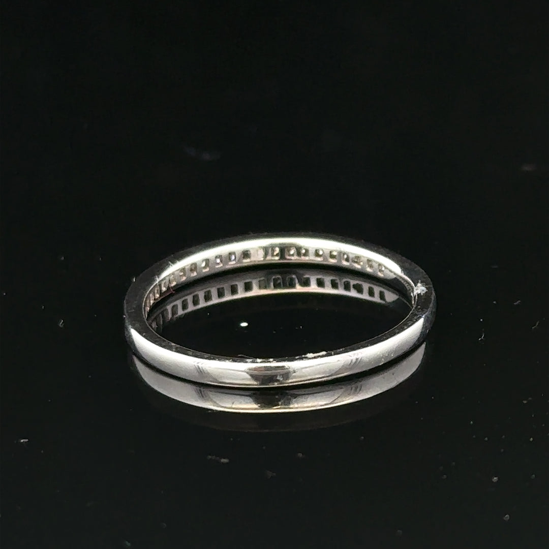 18ct white gold diamond ring with sparkling diamonds, size Q1/2, featuring a sleek band and intricate detailing.