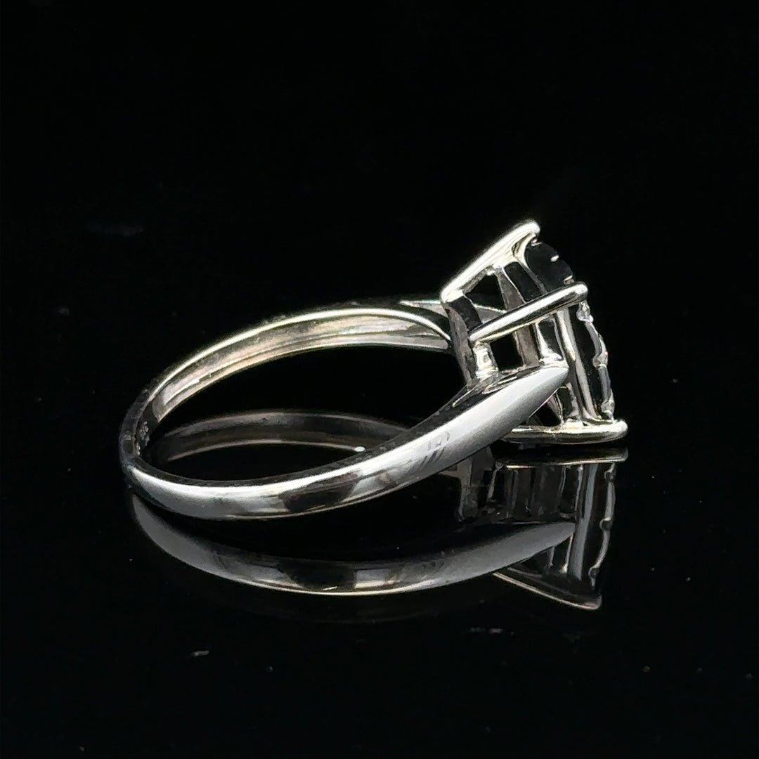9ct white gold half carat diamond ring with a central sparkling diamond and elegant band design.