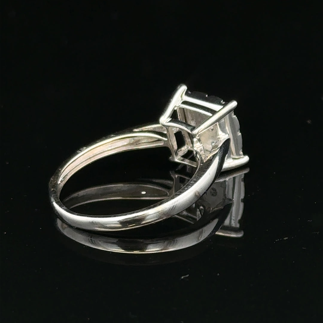 9ct white gold diamond ring with half-carat center stone, featuring elegant design and sparkling brilliance.