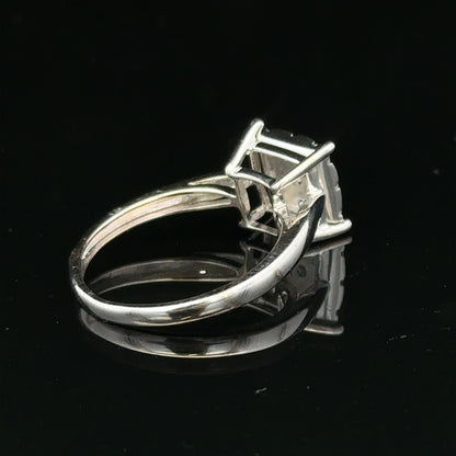 9ct white gold diamond ring with half-carat center stone, featuring elegant design and sparkling brilliance.