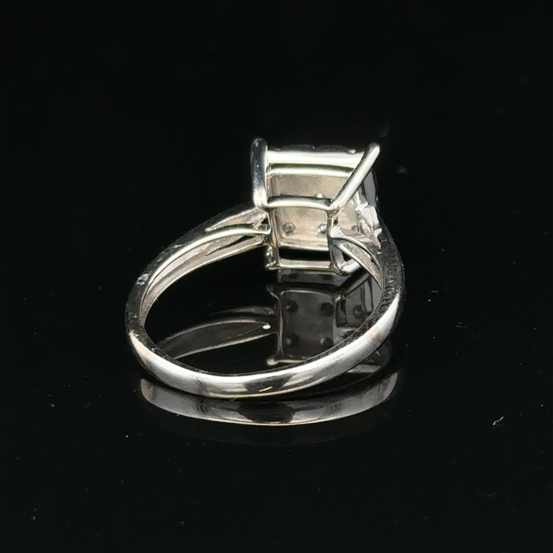9ct white gold diamond ring with half-carat center stone, featuring a sleek and elegant design.