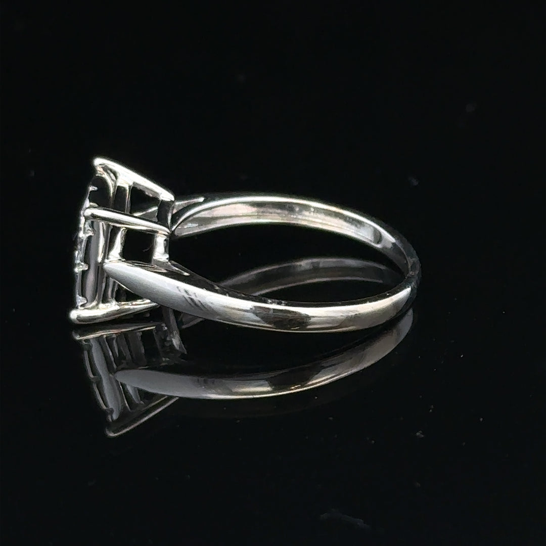 9ct white gold diamond ring with half-carat solitaire diamond, featuring a sleek band and sparkling gemstone.