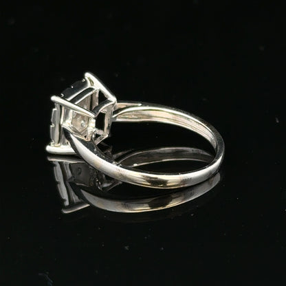 9ct white gold diamond ring with half-carat center stone, featuring elegant design and sparkling brilliance.