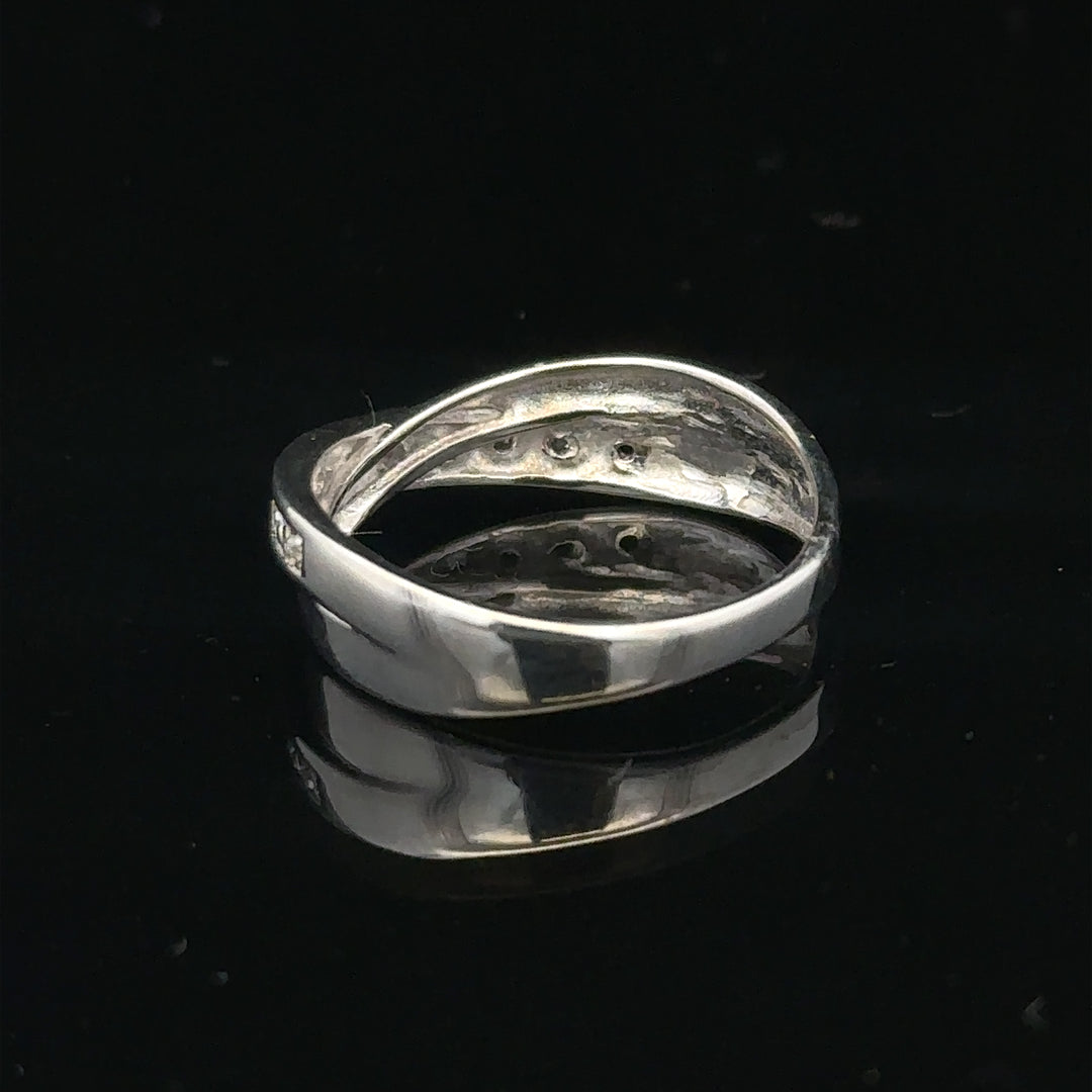 9ct white gold diamond ring in size J1/2, featuring sparkling diamonds and a polished band.