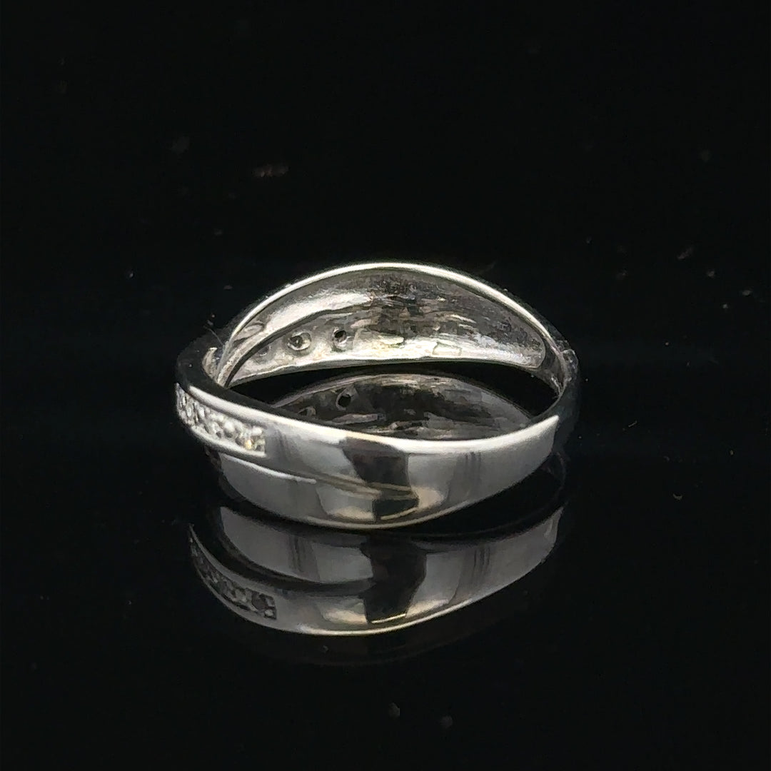 9ct white gold diamond ring size J1/2 with sparkling diamonds, showcasing a delicate and elegant jewelry piece.