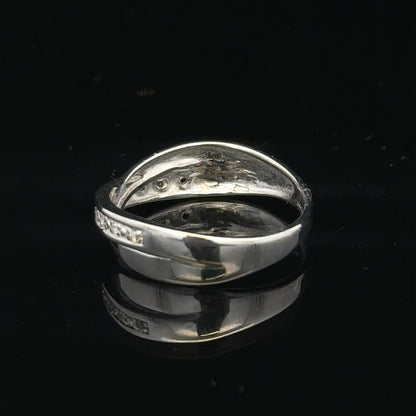 9ct white gold diamond ring size J1/2 with sparkling diamonds, showcasing a delicate and elegant jewelry piece.