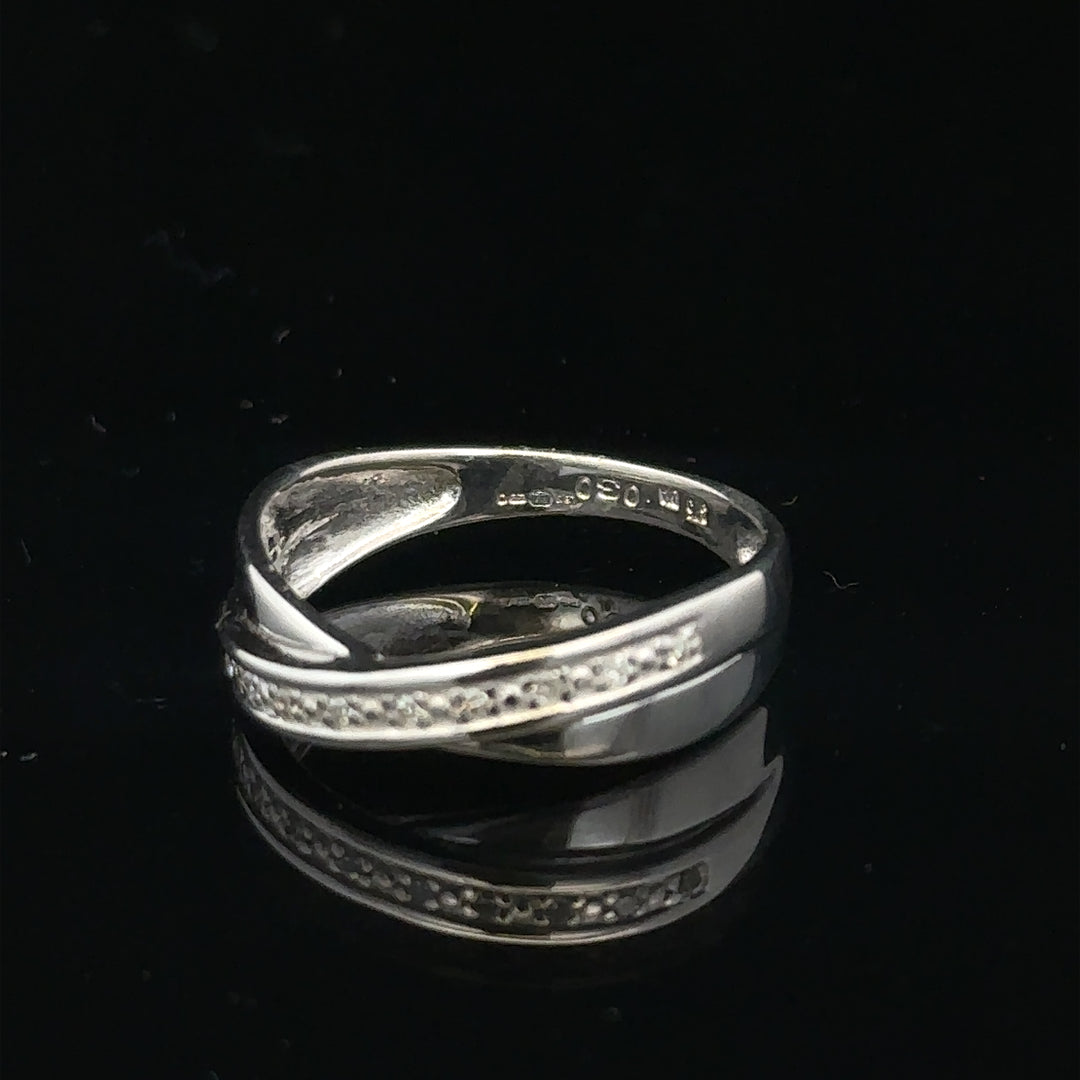 9ct white gold diamond ring in size J1/2 with sparkling diamonds, showcasing a elegant jewelry design.