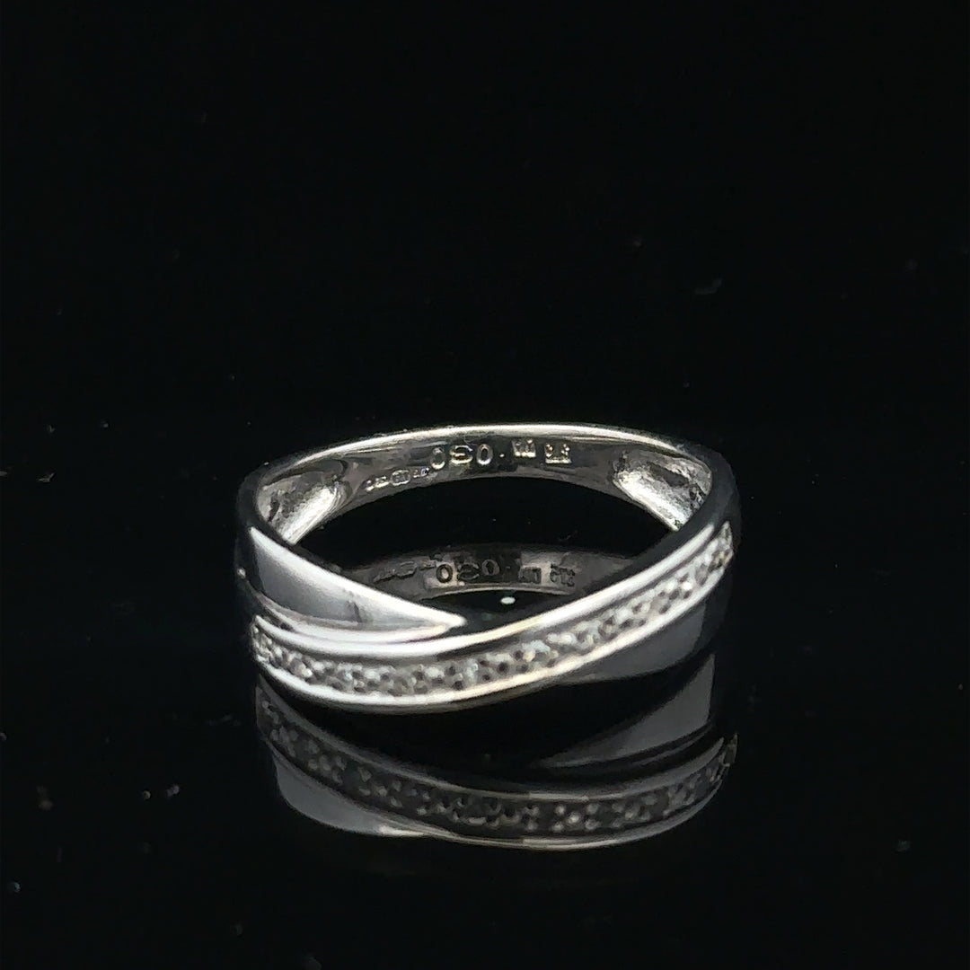 9ct white gold diamond ring in size J1/2, featuring a sparkling diamond setting on a sleek unbranded band.