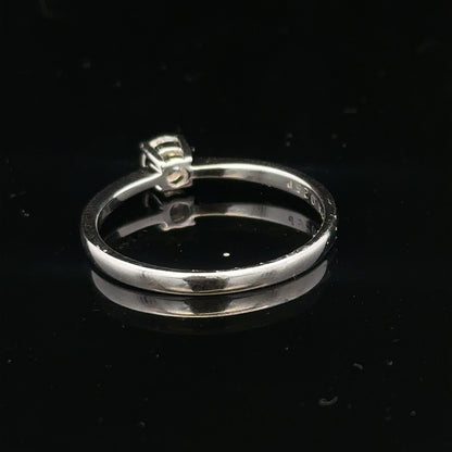 18ct white gold diamond ring with 1/4 carat solitaire, size P1/2, featuring a sparkling central diamond.
