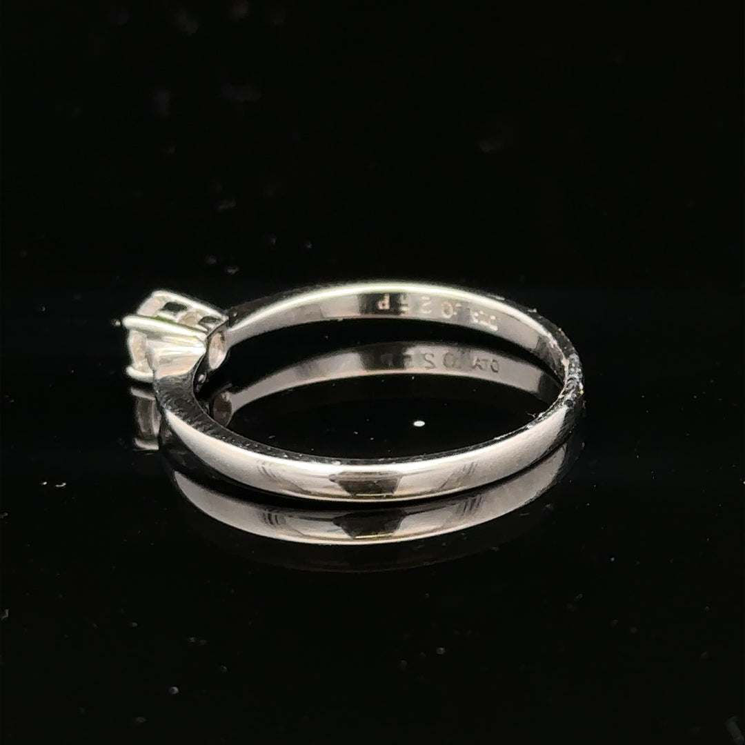 18ct white gold diamond ring with 1/4 carat round diamond, size P1/2, featuring a sleek band and sparkling gemstone.