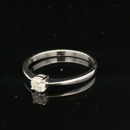 18ct white gold diamond ring with 1/4 carat total weight, size P1/2, featuring a sparkling diamond centerpiece.