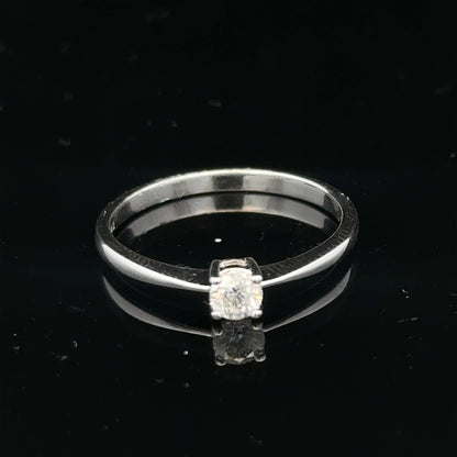 18ct white gold diamond ring with 1/4 carat solitaire, size P1/2, featuring a sparkling diamond setting.