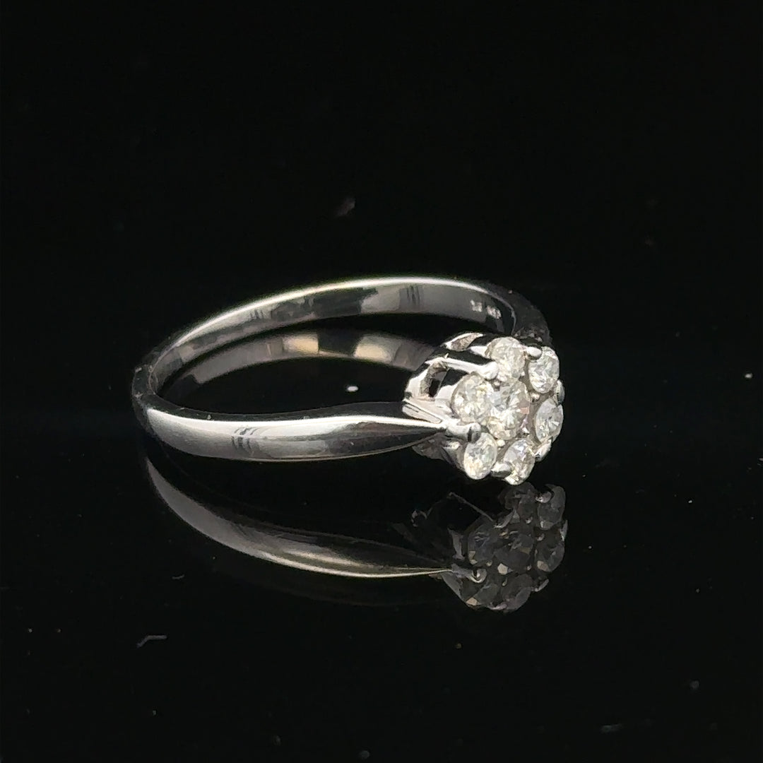 9ct white gold diamond cluster ring size O 1/2, featuring a sparkling diamond cluster setting on a polished band.