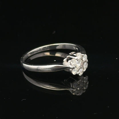 9ct white gold diamond cluster ring size O 1/2, featuring a sparkling diamond cluster setting on a polished band.
