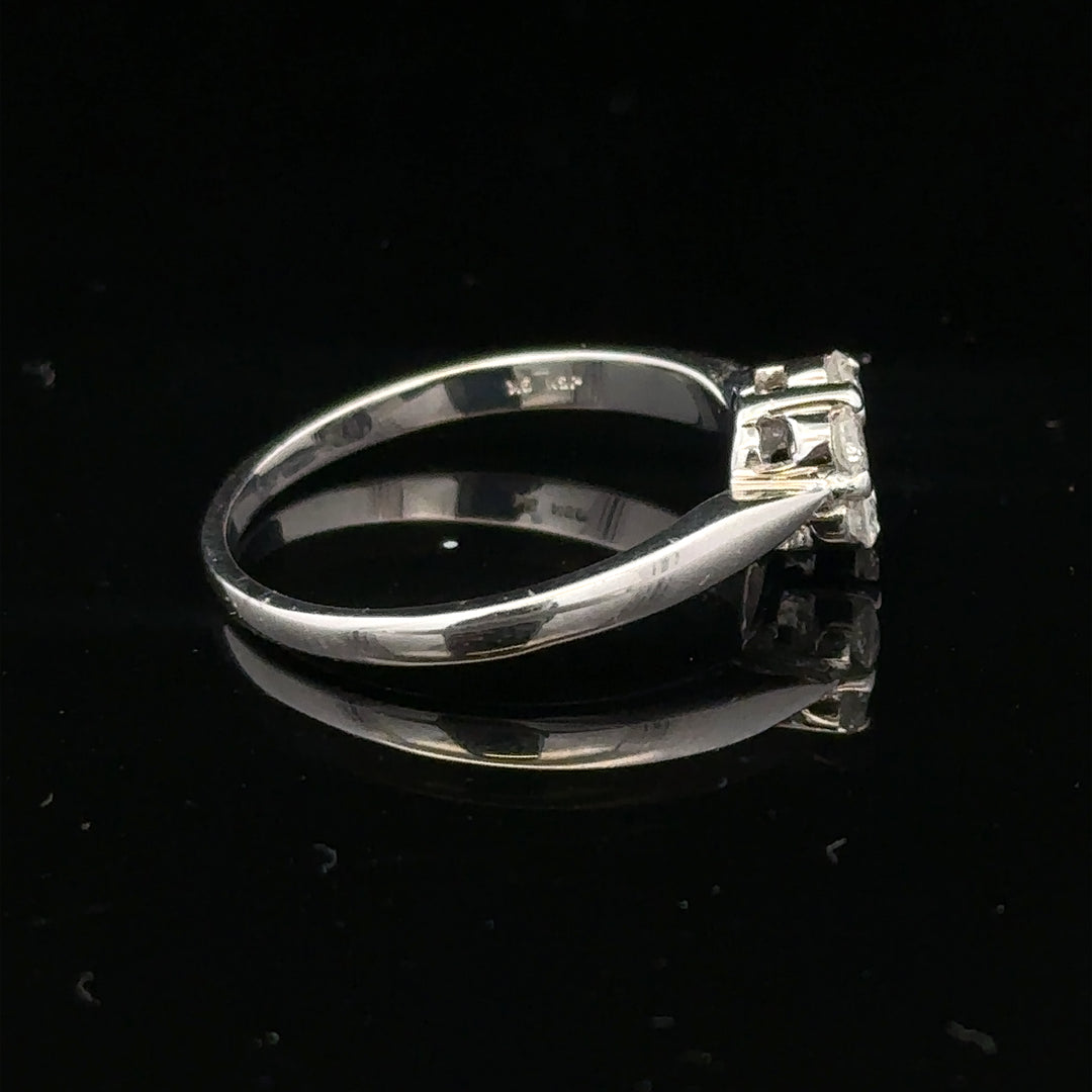 9ct white gold diamond cluster ring in size O 1/2 with multiple sparkling diamonds set in a elegant ring design.