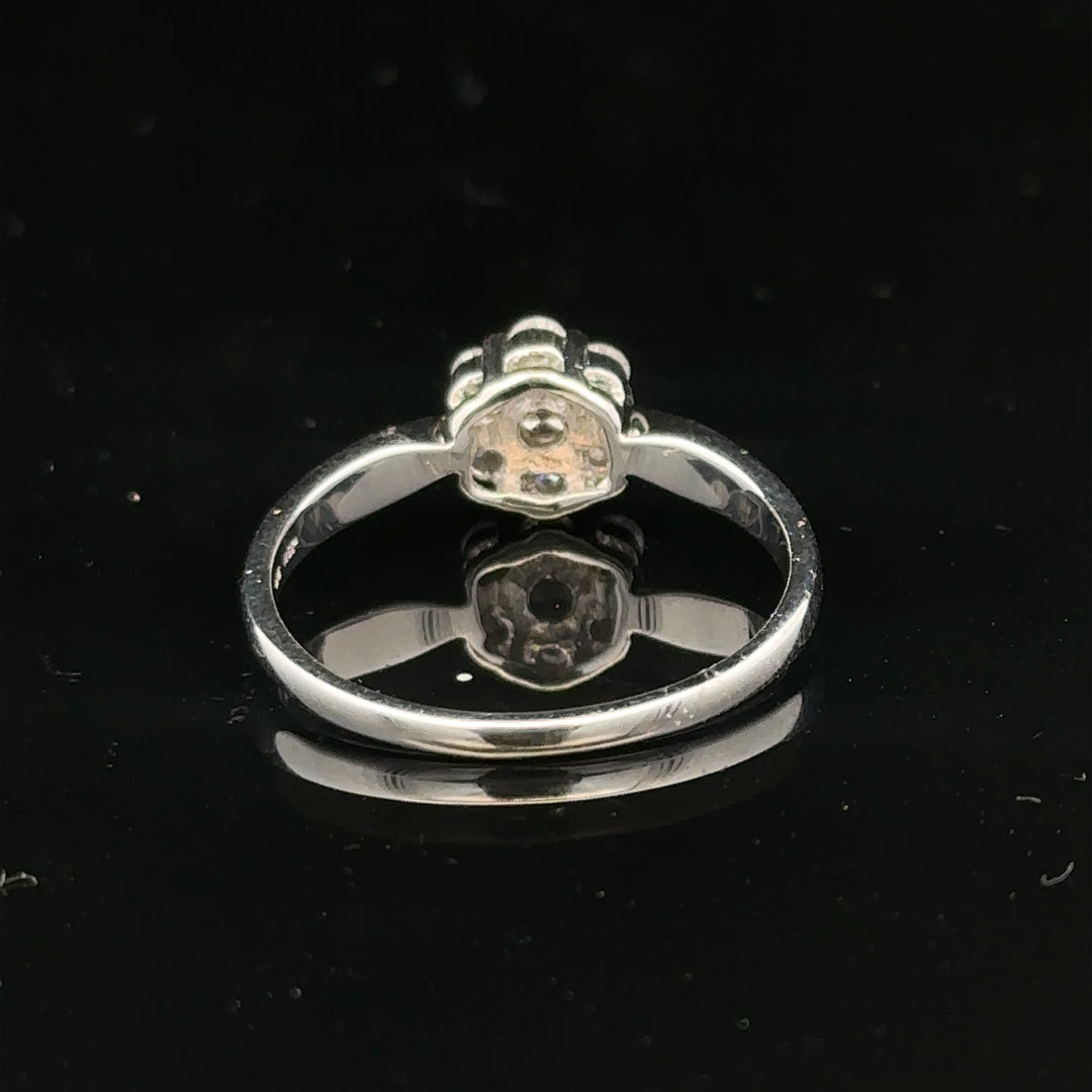 9ct white gold diamond cluster ring in size O 1/2, featuring a sparkling diamond cluster design.