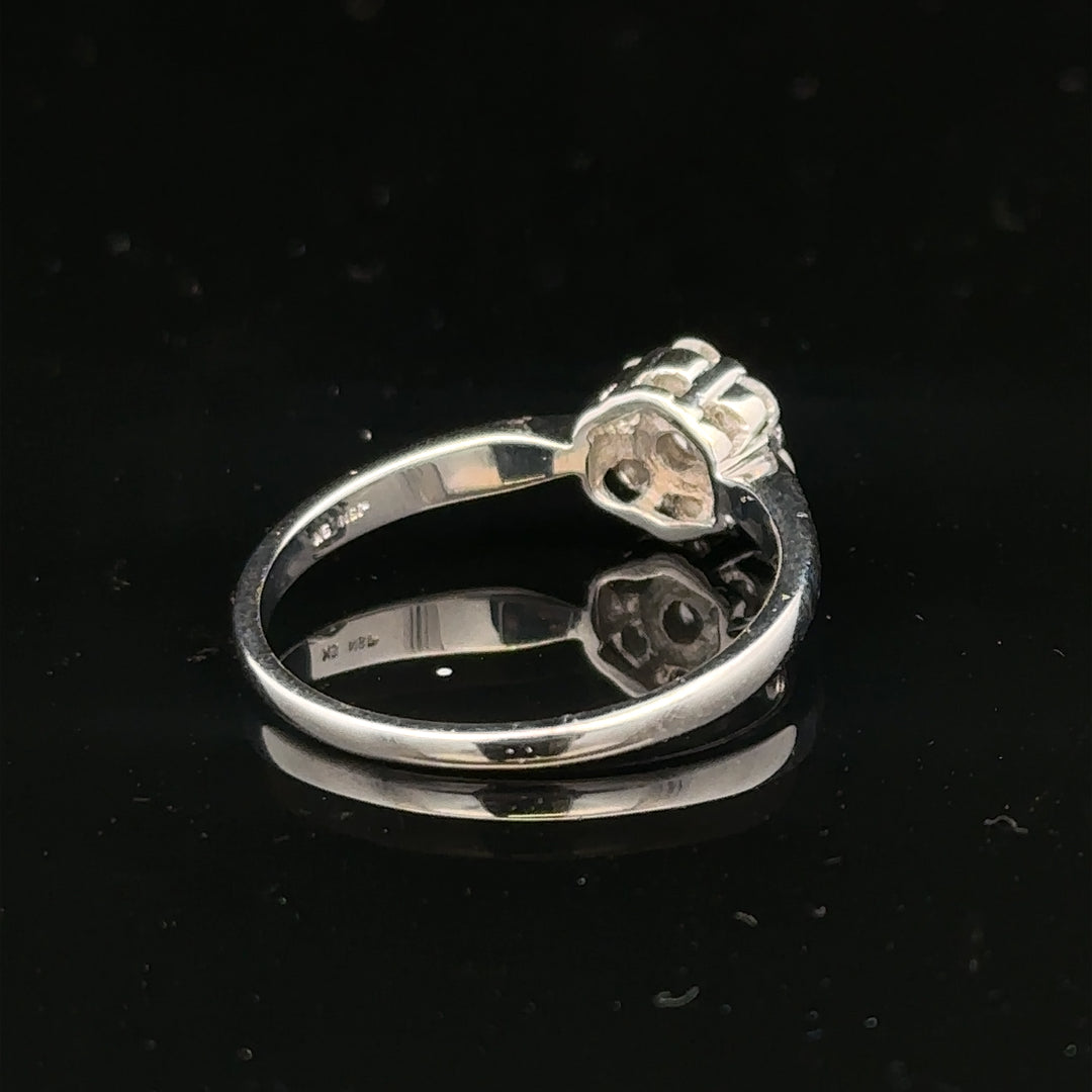 9ct white gold diamond cluster ring in size O 1/2, featuring a sparkling diamond cluster design.