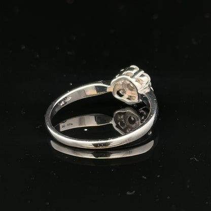9ct white gold diamond cluster ring in size O 1/2, featuring a sparkling diamond cluster design.