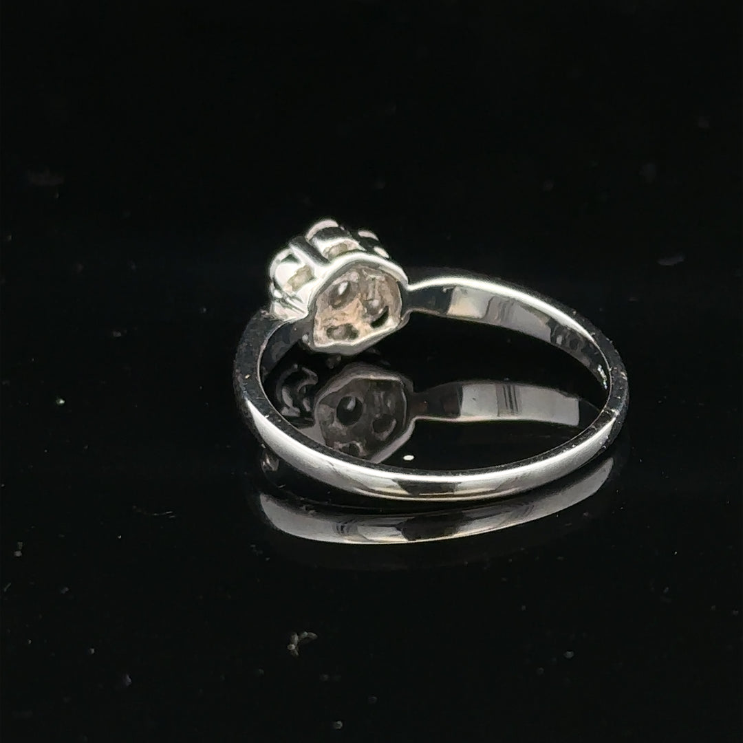 9ct white gold diamond cluster ring in size O 1/2 showing a sparkling diamond cluster setting on a sleek band